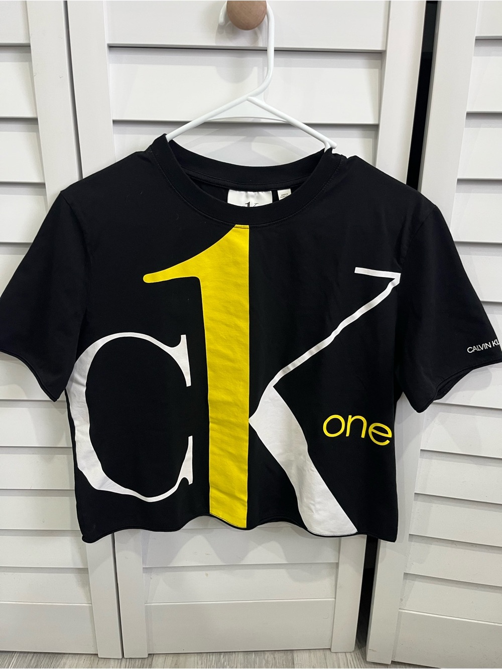 Calvin Klein black Tee shirt with Yellow & White Graphic